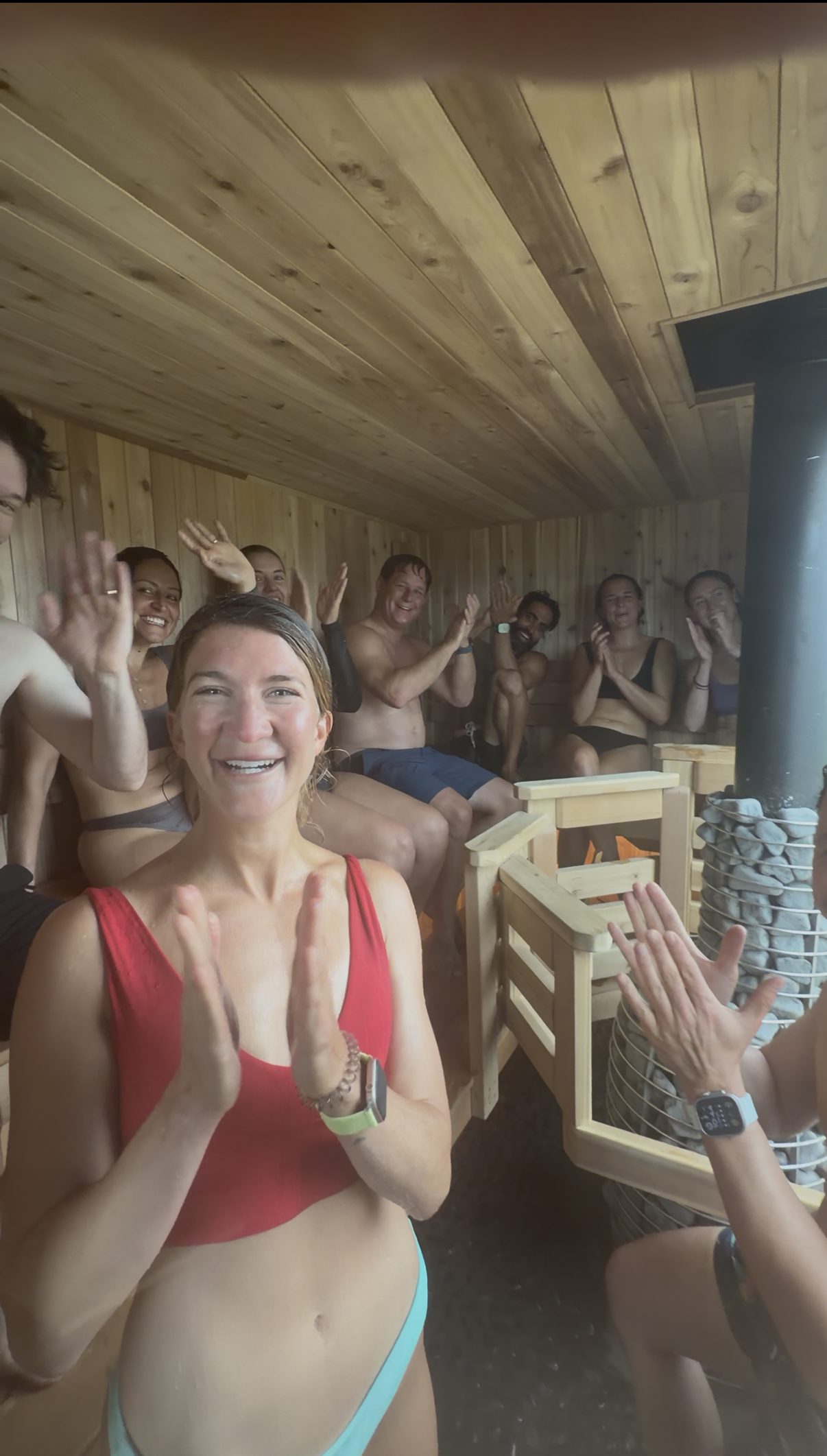 The Full Send Fridays group together in the wood-fired sauna